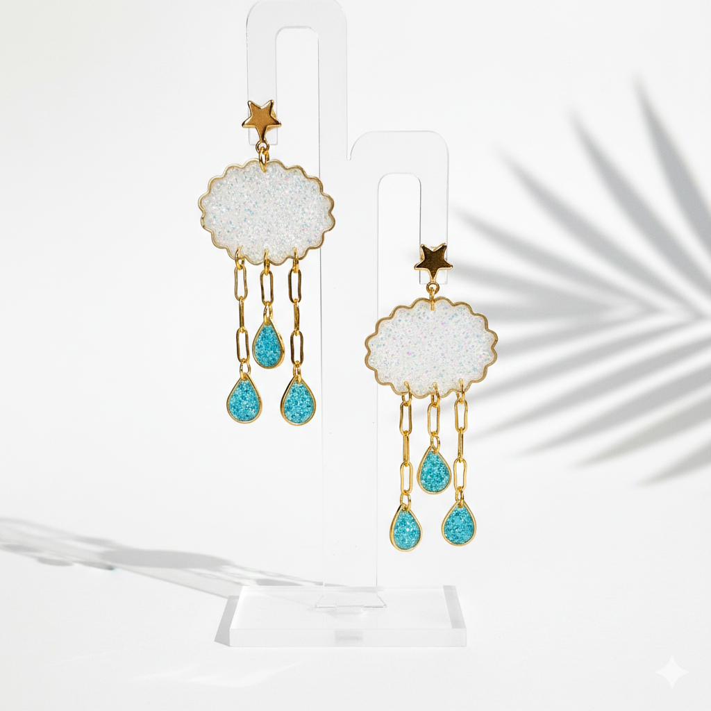 Earrings with a white cloud and teal coloured raindrops. Handmade by RainbowRegalia, Greystones, Co. Wicklow.