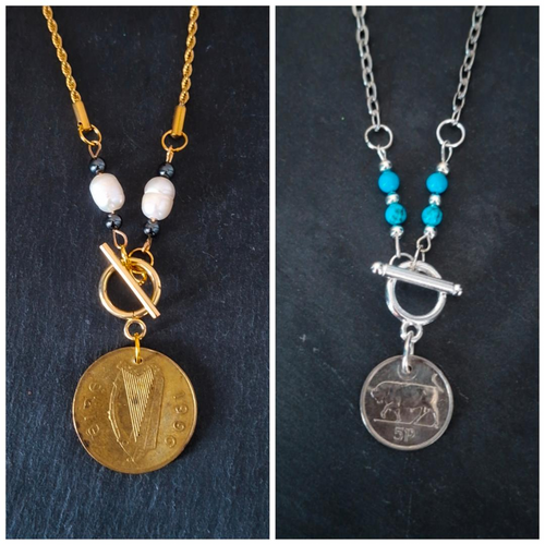 Two necklaces: One made with genuine Irish 1996 20p coin, repurposed freshwater pearls and hematite beads. Suspended from gold-plated chain. The other is made using a genuine Irish 1996 5p coin, repurposed turquoise beads and suspended from a stainless steel chain. 