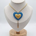 Blue and gold heart necklace on a gold-plated rope chain