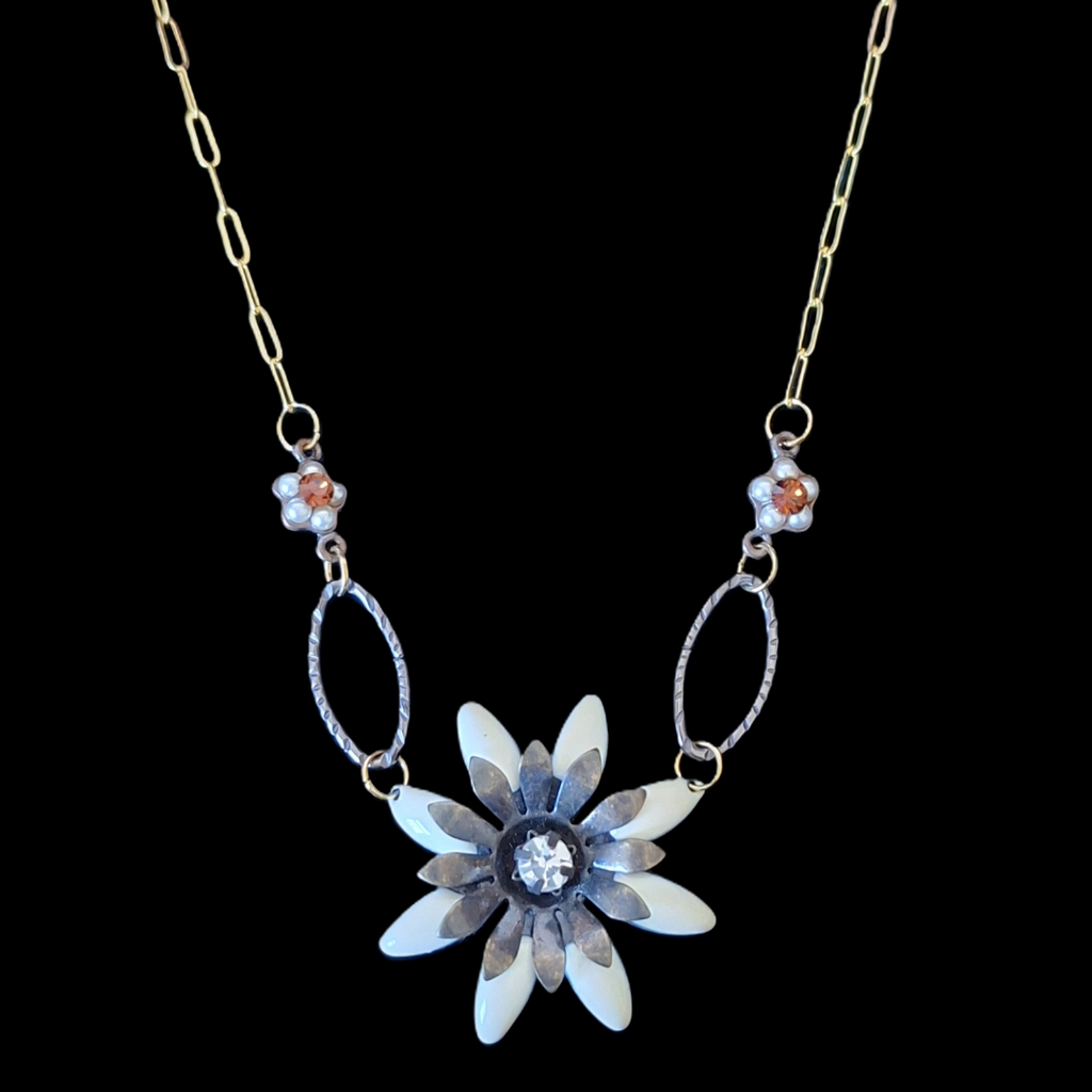 Necklace with a flower-shaped pendant on a black background