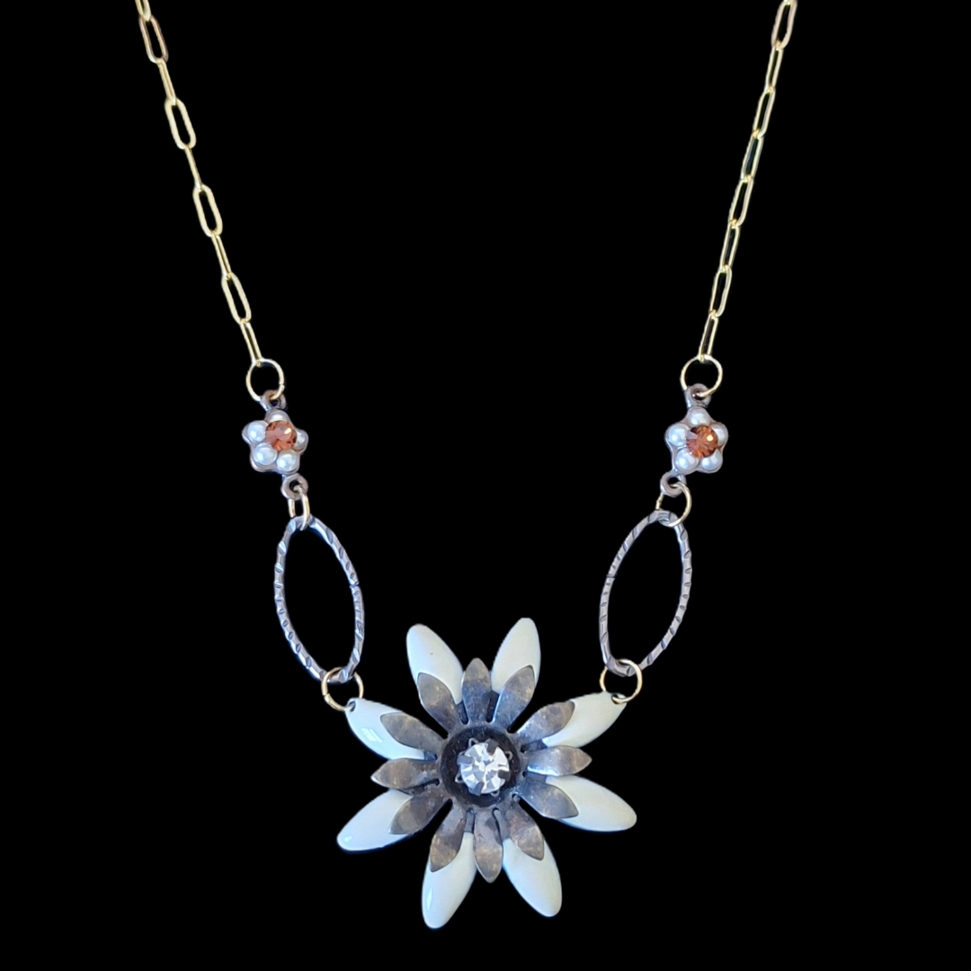 Necklace with a flower-shaped pendant on a black background