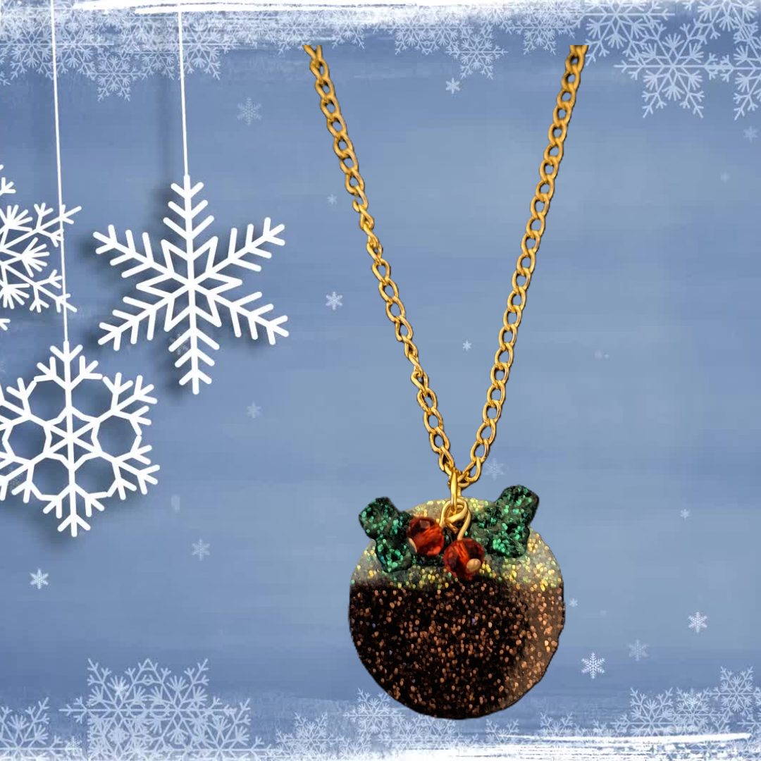 Necklace with a Christmas pudding-themed pendant on a blue background with snowflakes