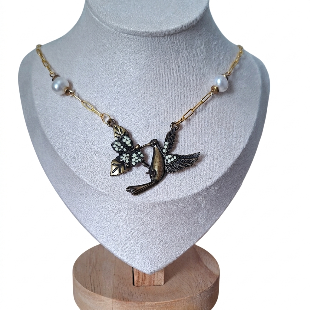 Hummingbird necklace with pearls on a gold chain