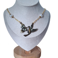 Hummingbird necklace with pearls on a gold chain