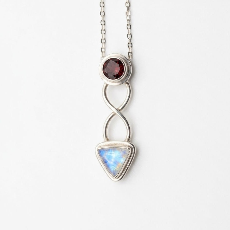 Sterling silver rainbow moonstone and garnet celtic necklace