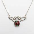 Scottish Heathergems necklace with sterling silver Celtic knotwork and a round red-and-green heather cabochon on a silver chain.