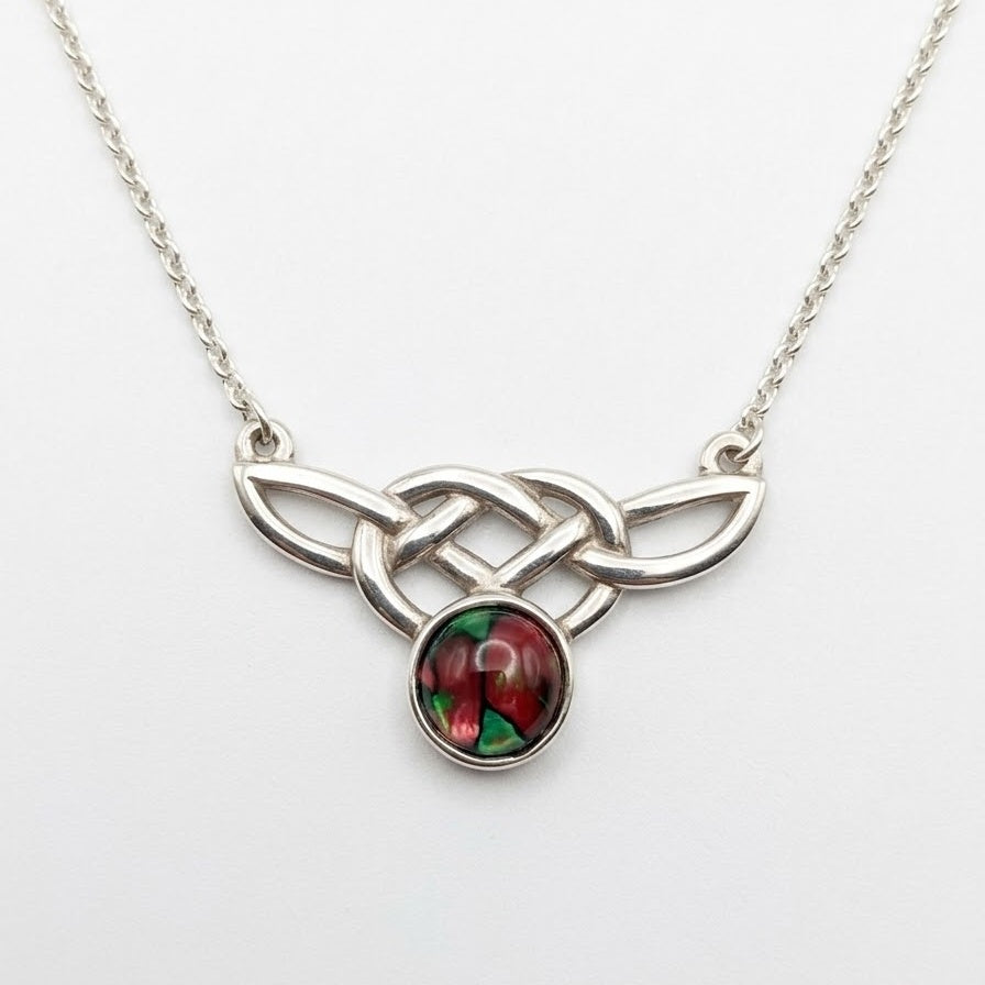 Scottish Heathergems necklace with sterling silver Celtic knotwork and a round red-and-green heather cabochon on a silver chain.