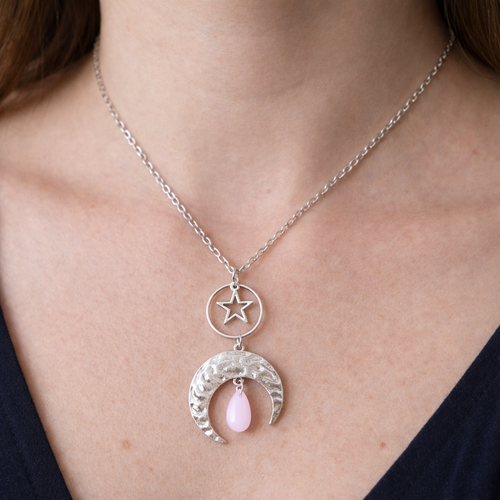 Necklace with a star and crescent moon pendant with pink glass teardrop bead. Made using repurposed pieces and suspended on a stainless steel chain. By RainbowRegalia, Greystones, Co Wicklow.