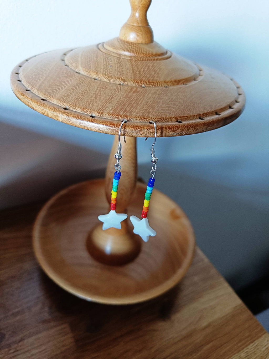 Rainbow Star Earrings with glass seed beads and star-shaped shell.