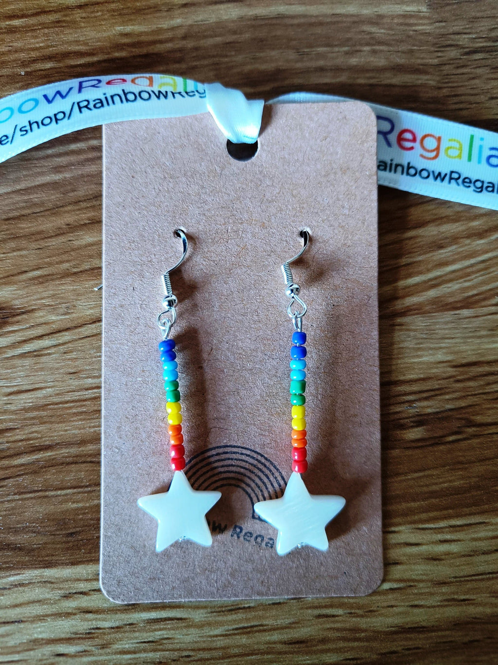 Rainbow Star Earrings with colorful glass seed beads and star-shaped shell.