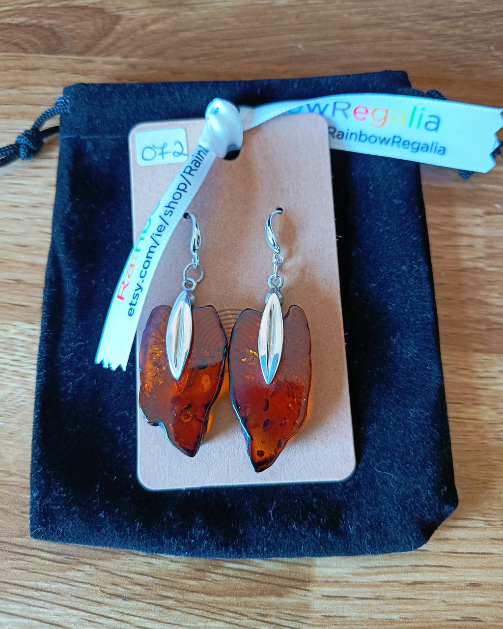 Silver amber earrings with sterling silver hooks, 65mm long.