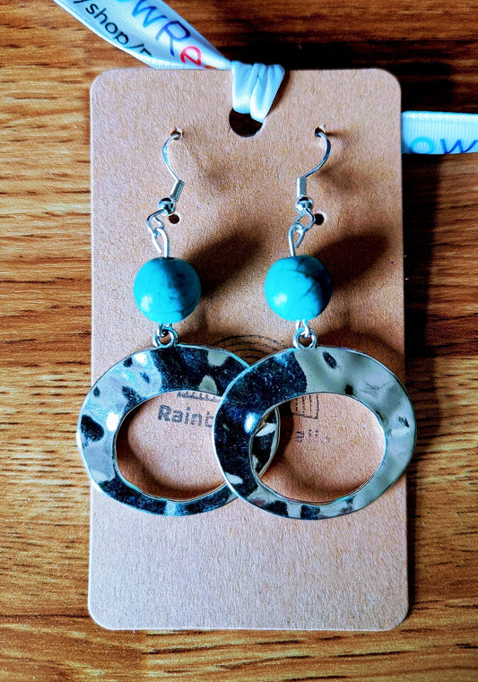 Turquoise hoop earrings with large antique silver hoops and repurposed turquoise stone beads.