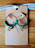 Teal Star Hoops with gold brass, teal ceramic beads, and gold star charm.