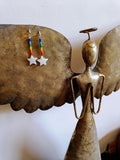 Rainbow Star Earrings with repurposed rainbow glass beads and white star-shaped shells on sterling silver ear wires.