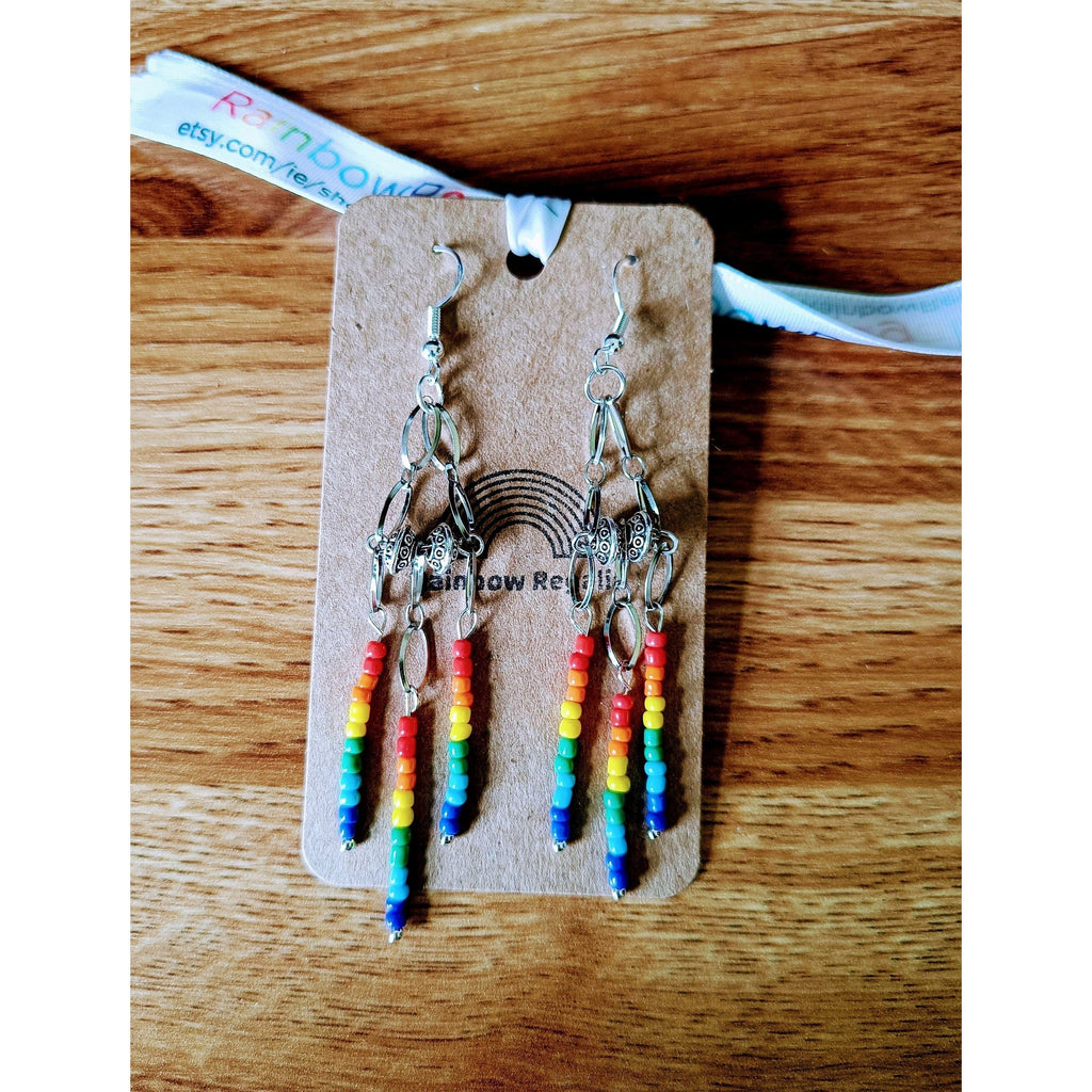 Rainbow chandelier earrings with repurposed glass seed beads and Tibetan silver beads.
