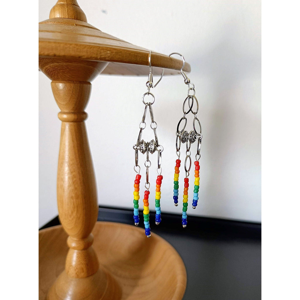 Rainbow chandelier earrings with repurposed glass seed beads and Tibetan silver accents.