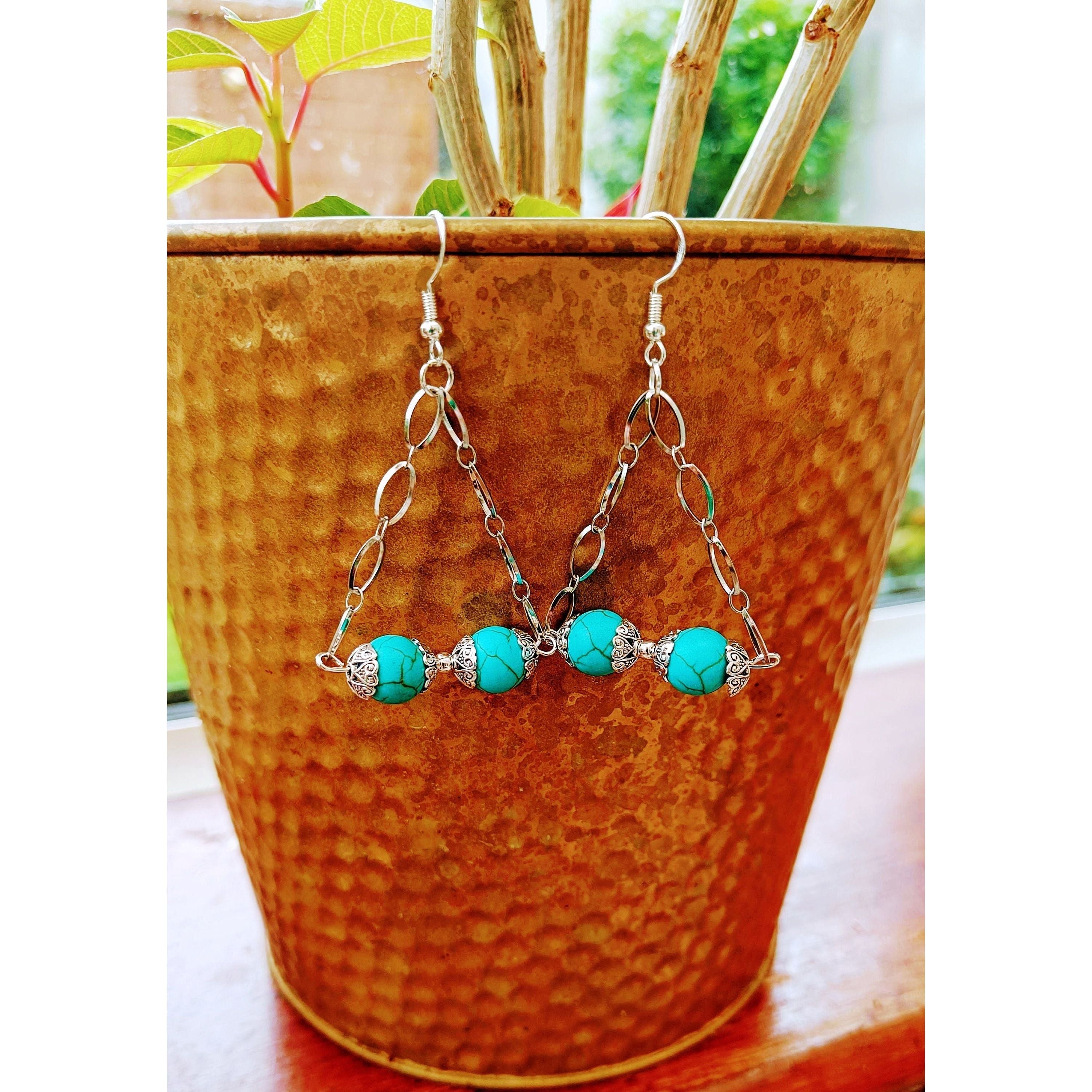 Silver and turquoise chandelier earrings with repurposed turquoise stone beads and stainless steel chain.