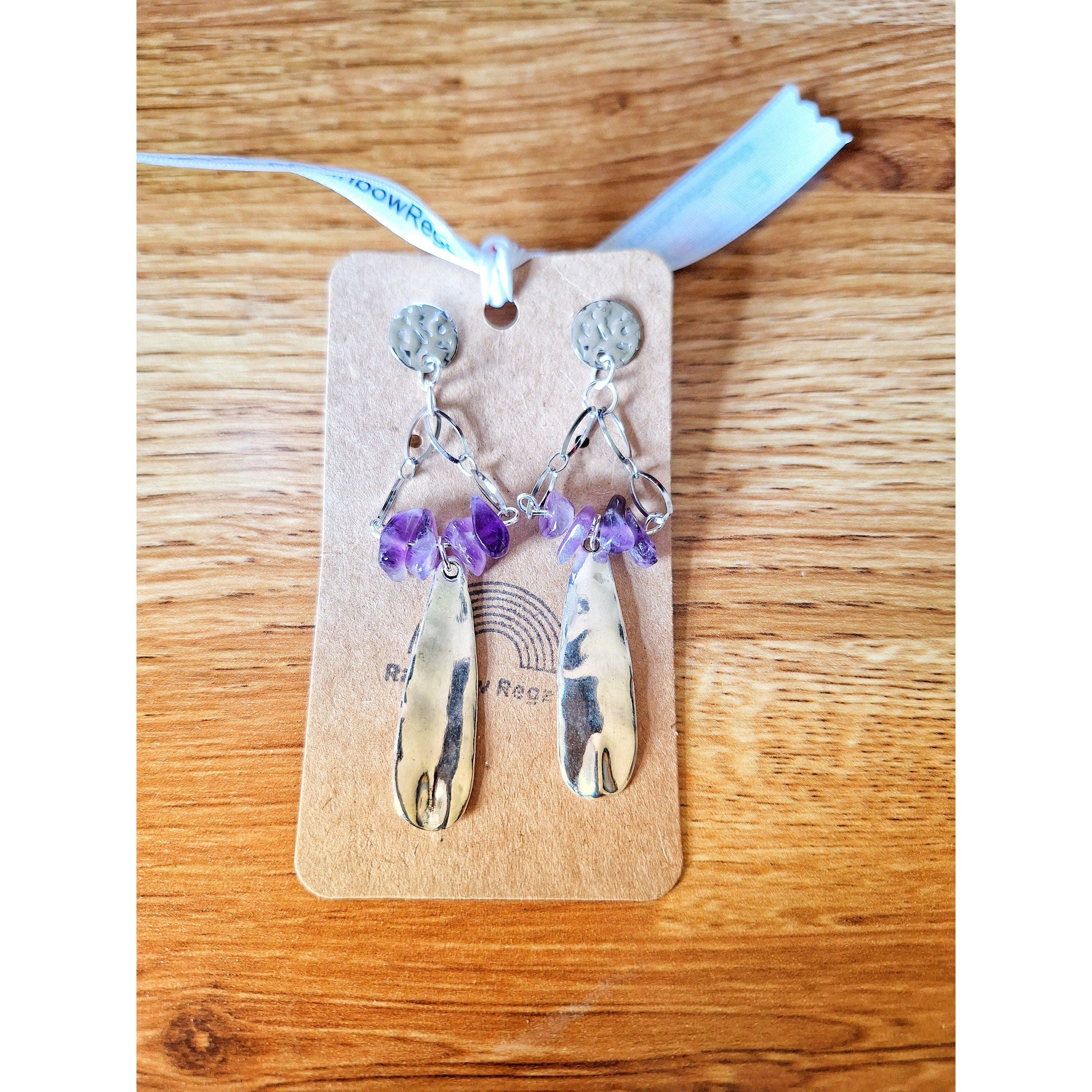 Aurora Chandelier Earrings with amethyst chips and hammered stainless steel on display.