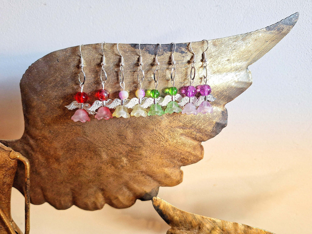 Angelica Silver Angel Earrings with repurposed glass beads on a wing display