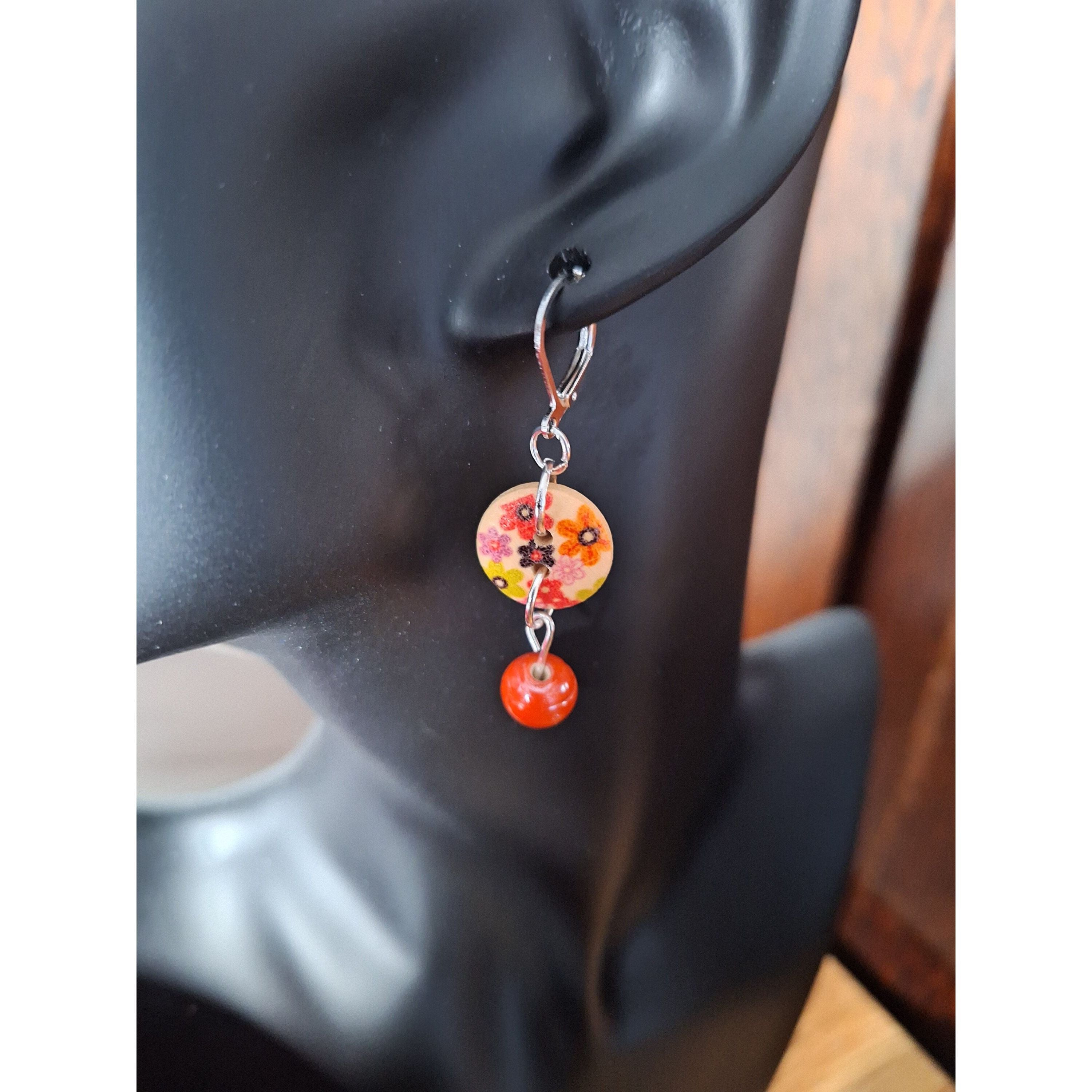 Fleur Drop Earrings with floral design and terracotta bead.