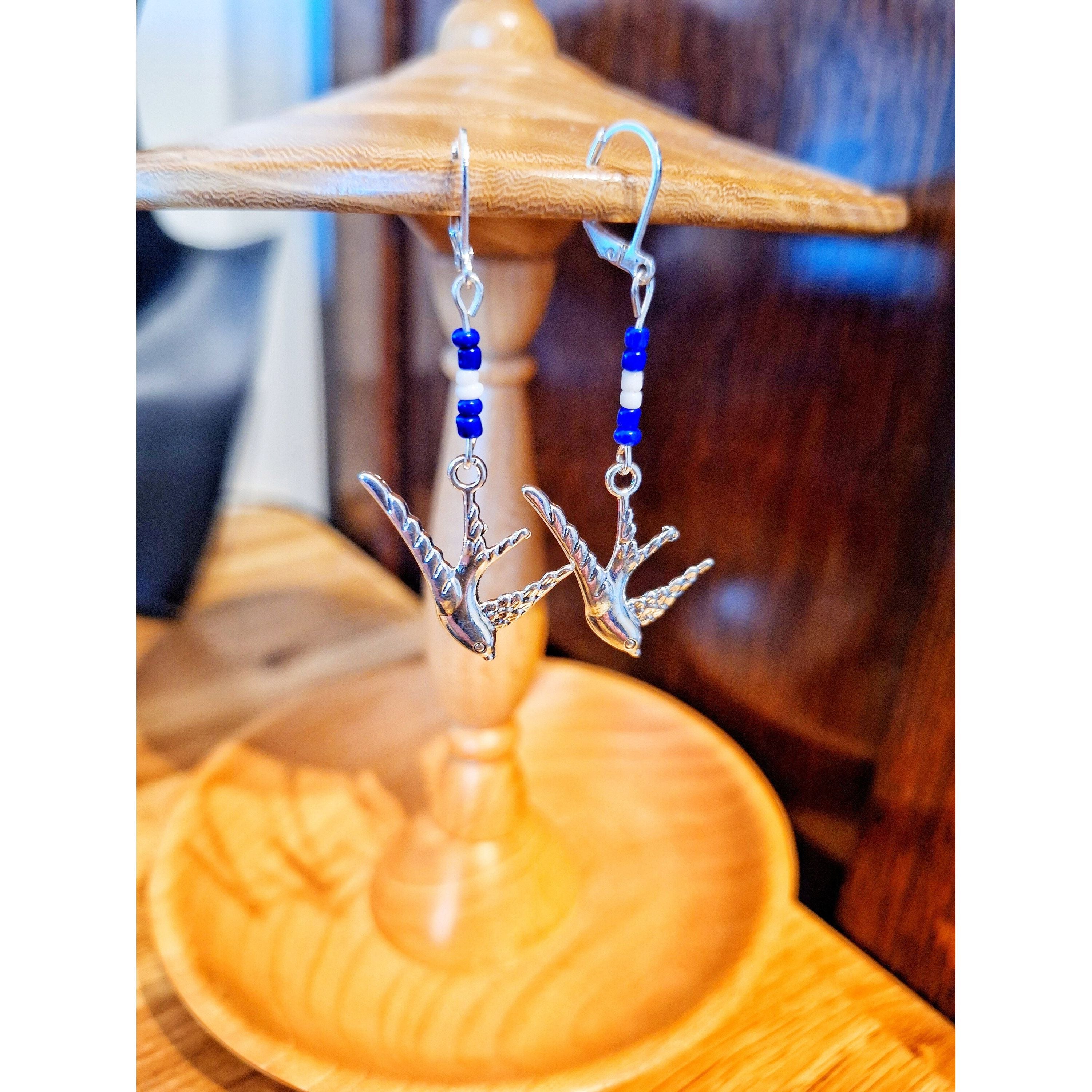 Svala Swallow Earrings made from repurposed glass seed beads with sterling silver ear wires, symbolizing grace and freedom.