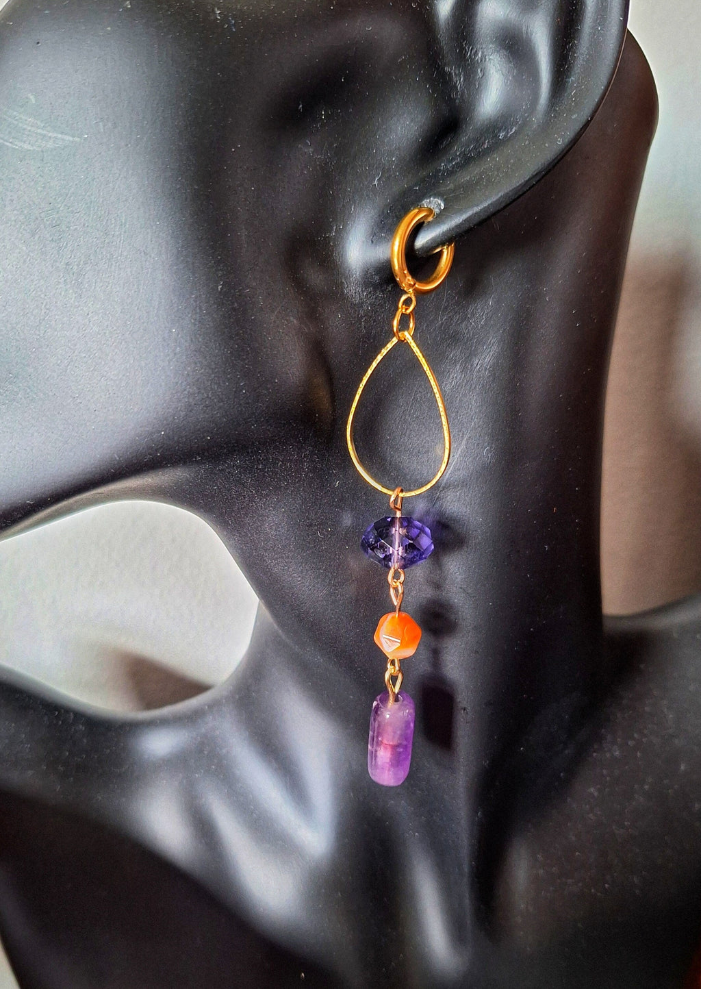 Chloe Mismatched Earrings with amethyst, tourmaline, and glass beads hanging from gold-plated huggies.