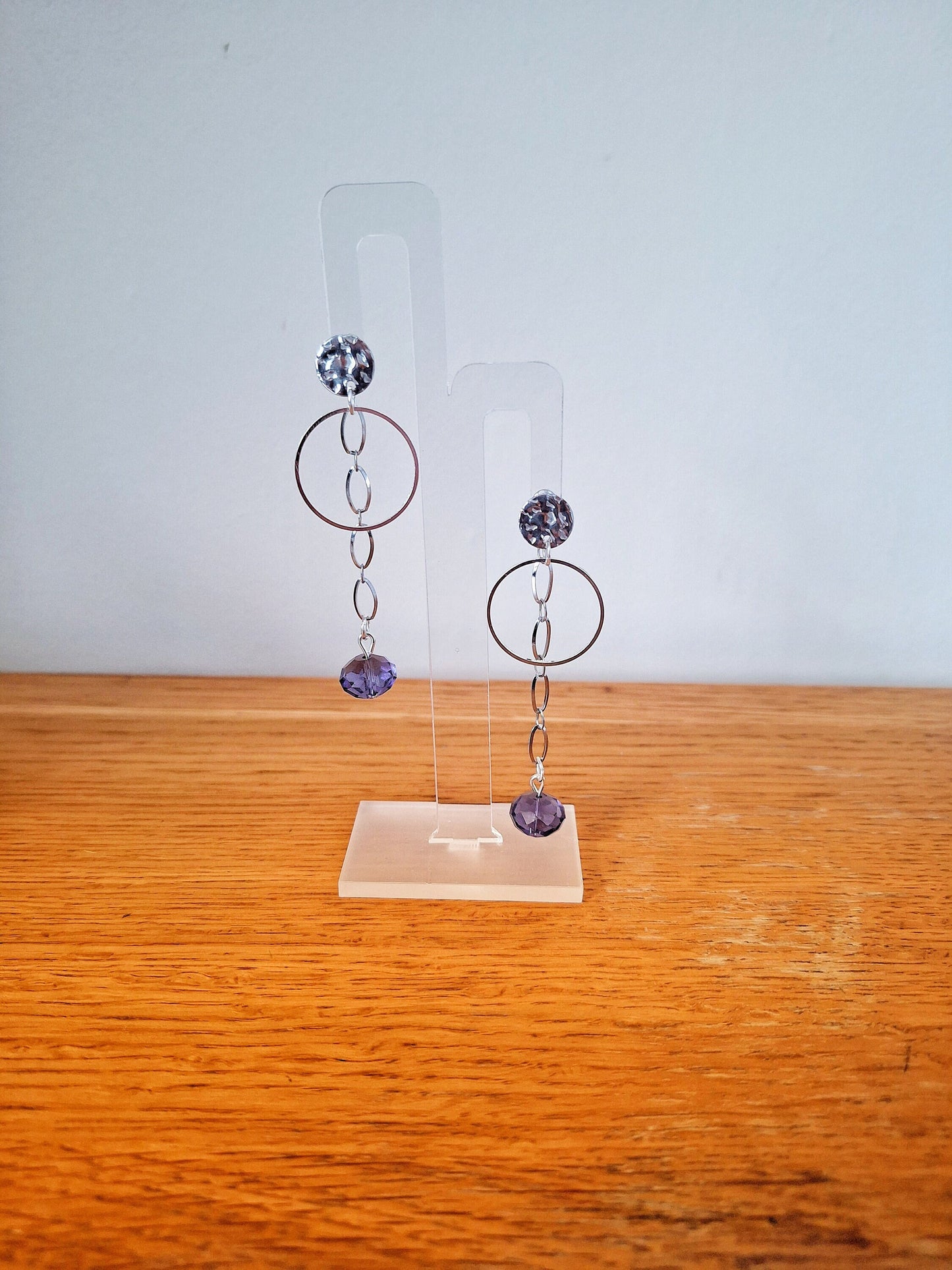 Silver chain drop earrings featuring purple beads