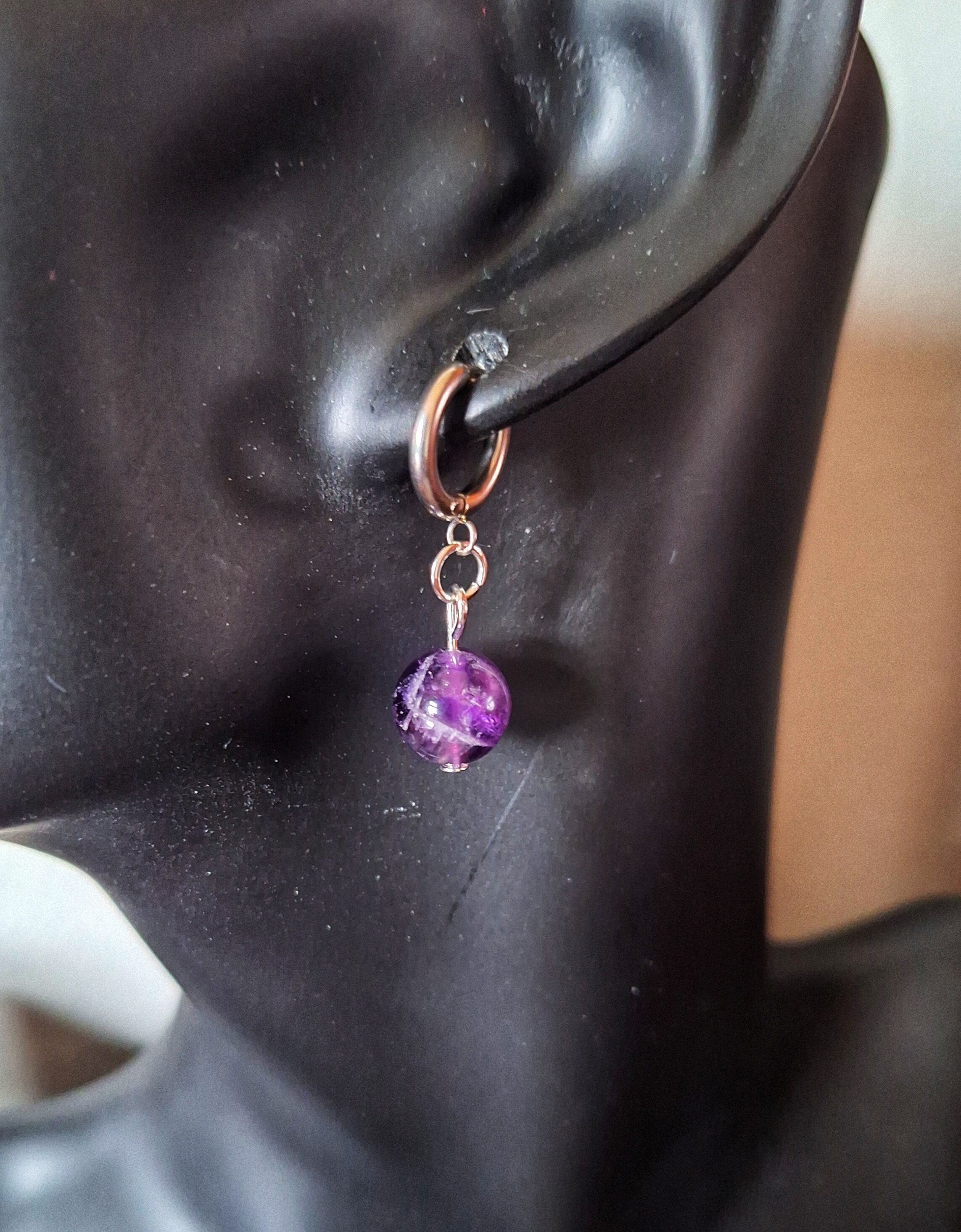 Lydia Amethyst Huggies with genuine amethyst bead on stainless steel hoop earring.