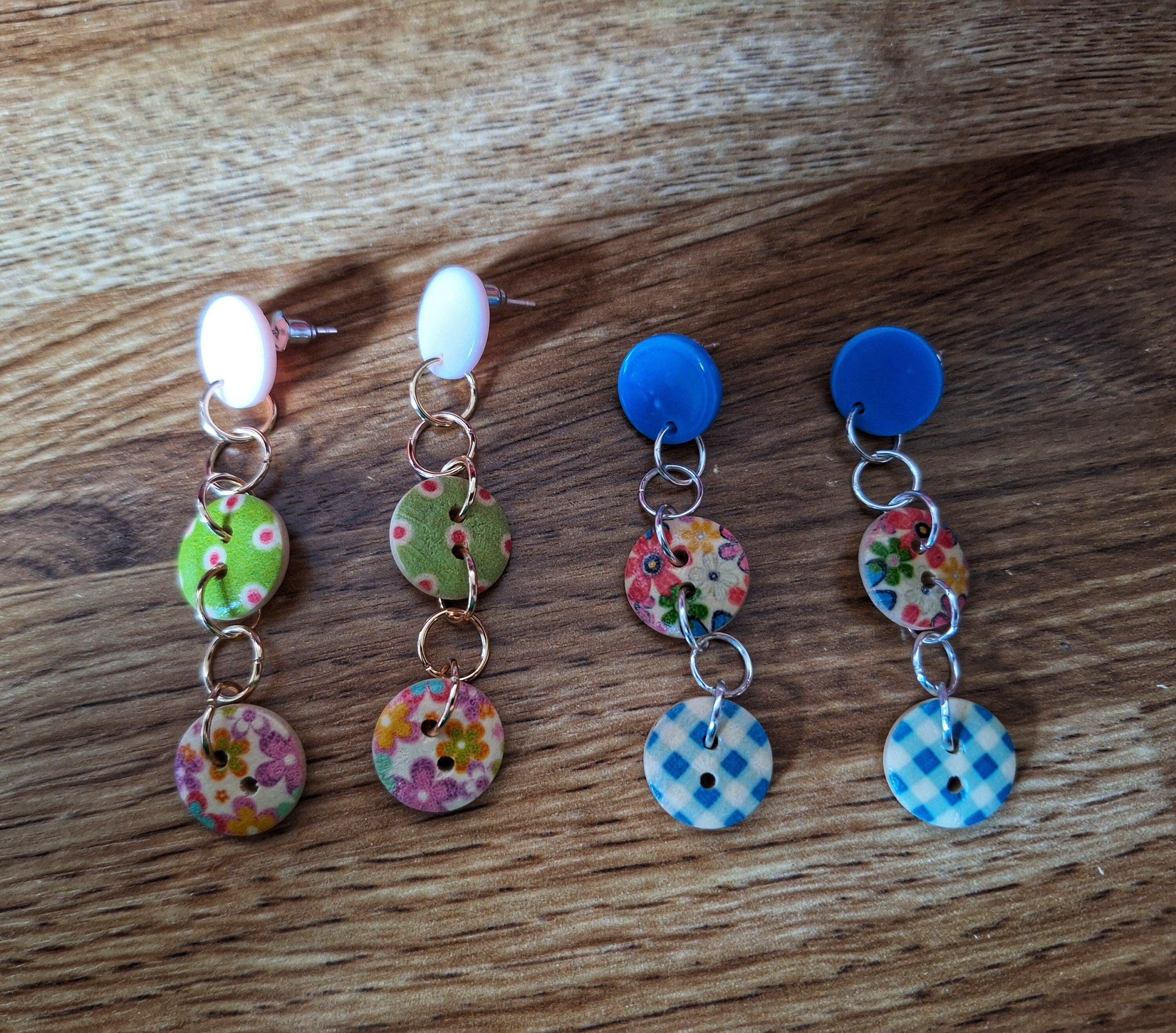Bella Button Earrings in blue and pink with wooden buttons and acrylic discs.