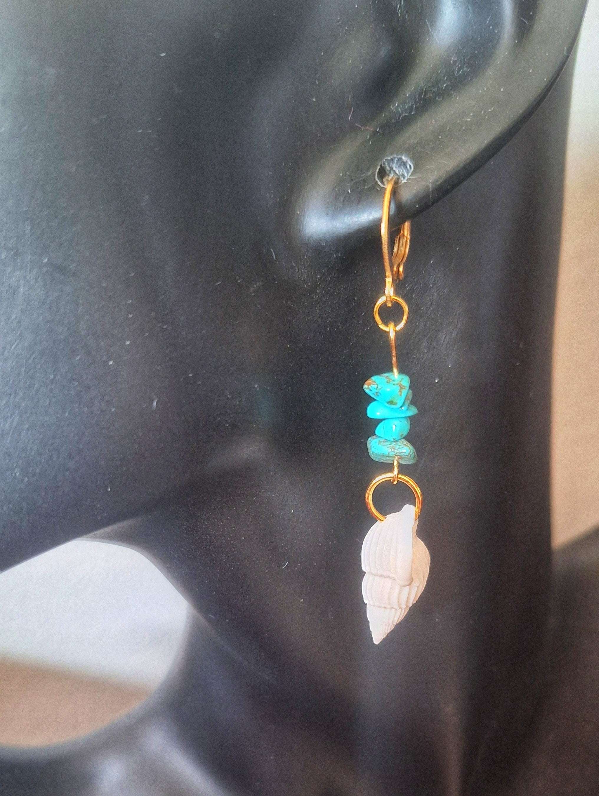 Turquoise and Conch Shell Earrings with gold huggie showcasing boho chic style.