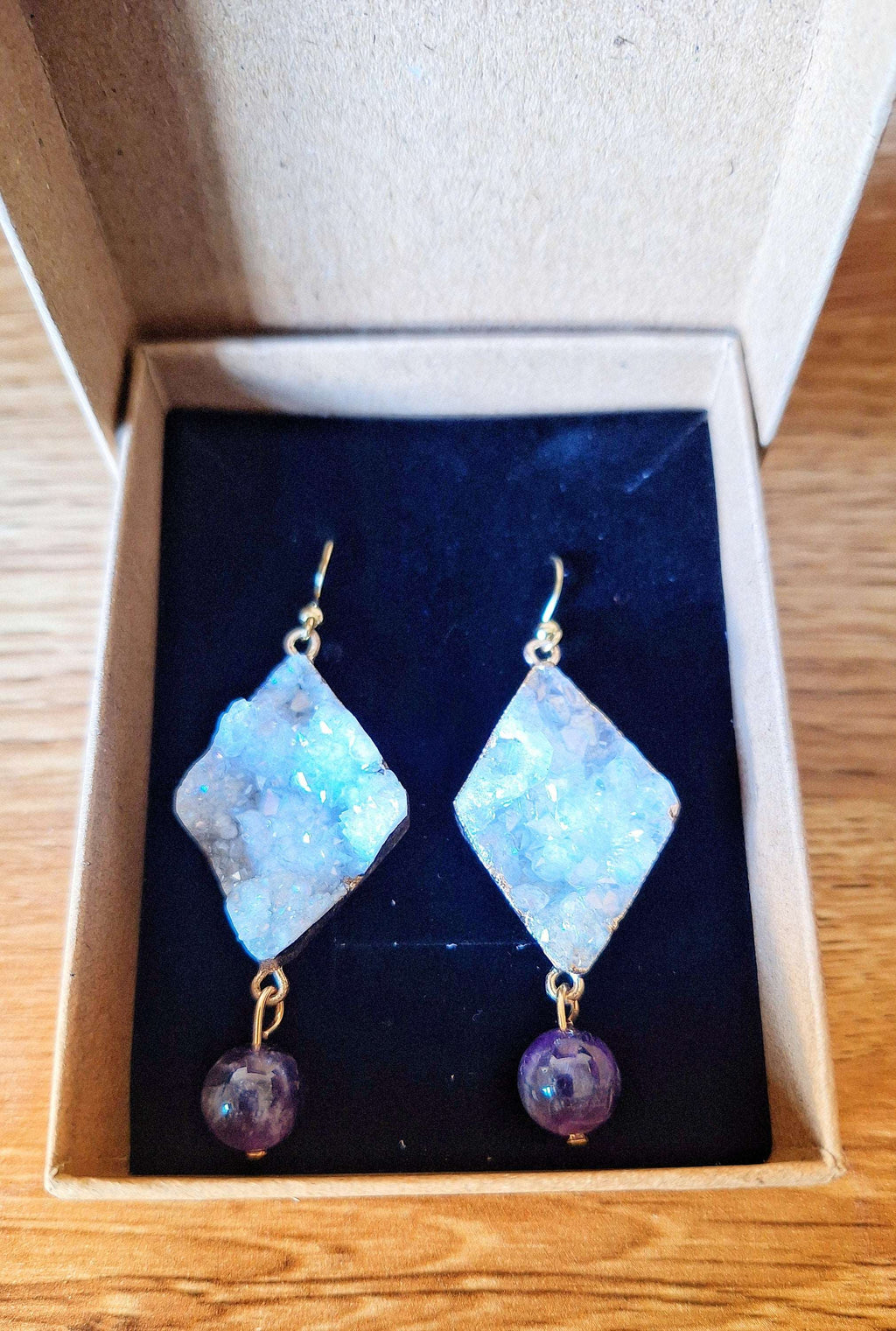 Aphrodite Quartz and Amethyst Earrings in gift box, featuring repurposed amethyst beads and gold-plated natural quartz.