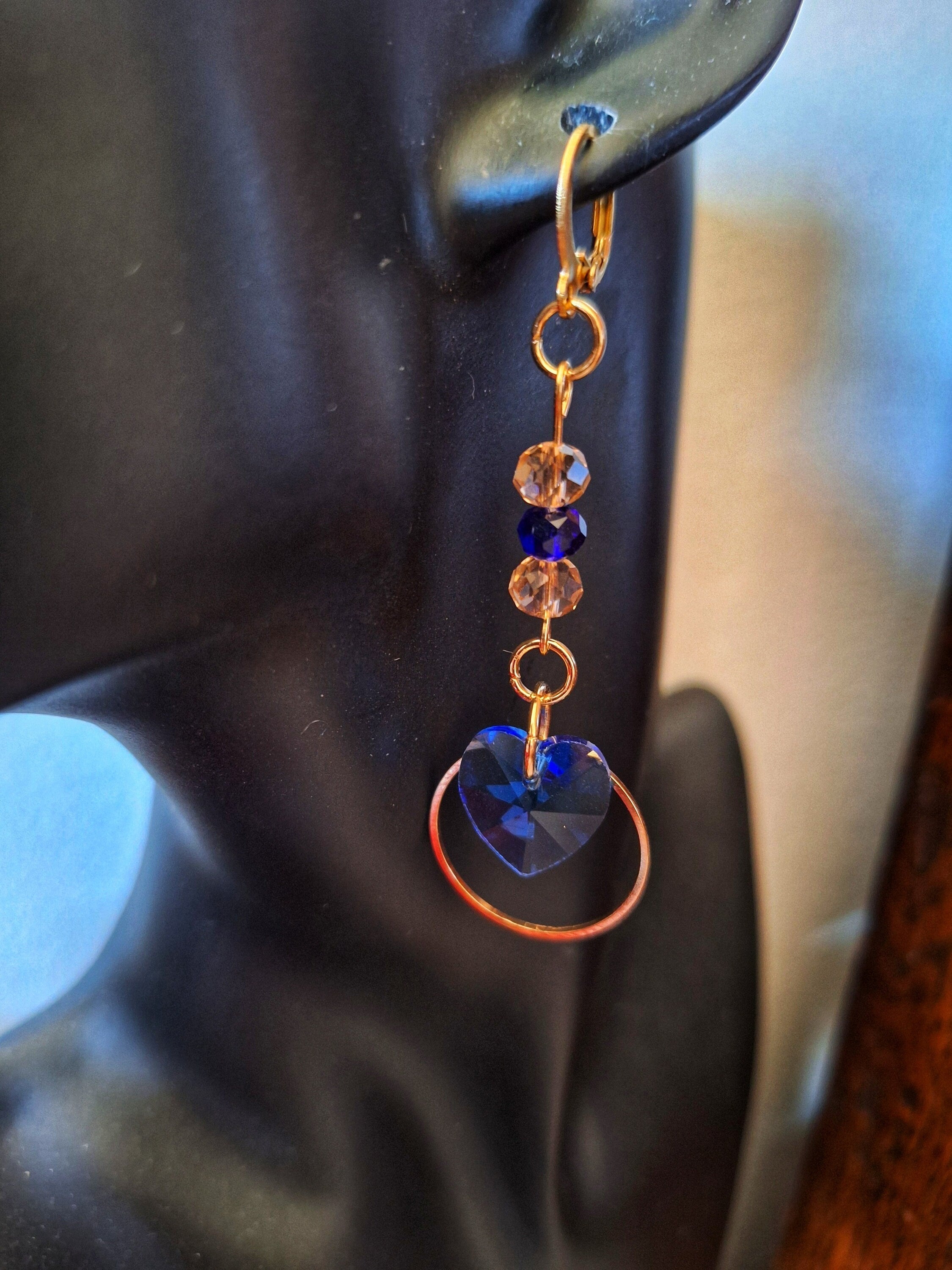 Amy Blue Heart Earrings with blue and pink glass beads on gold-plated huggie hoops.
