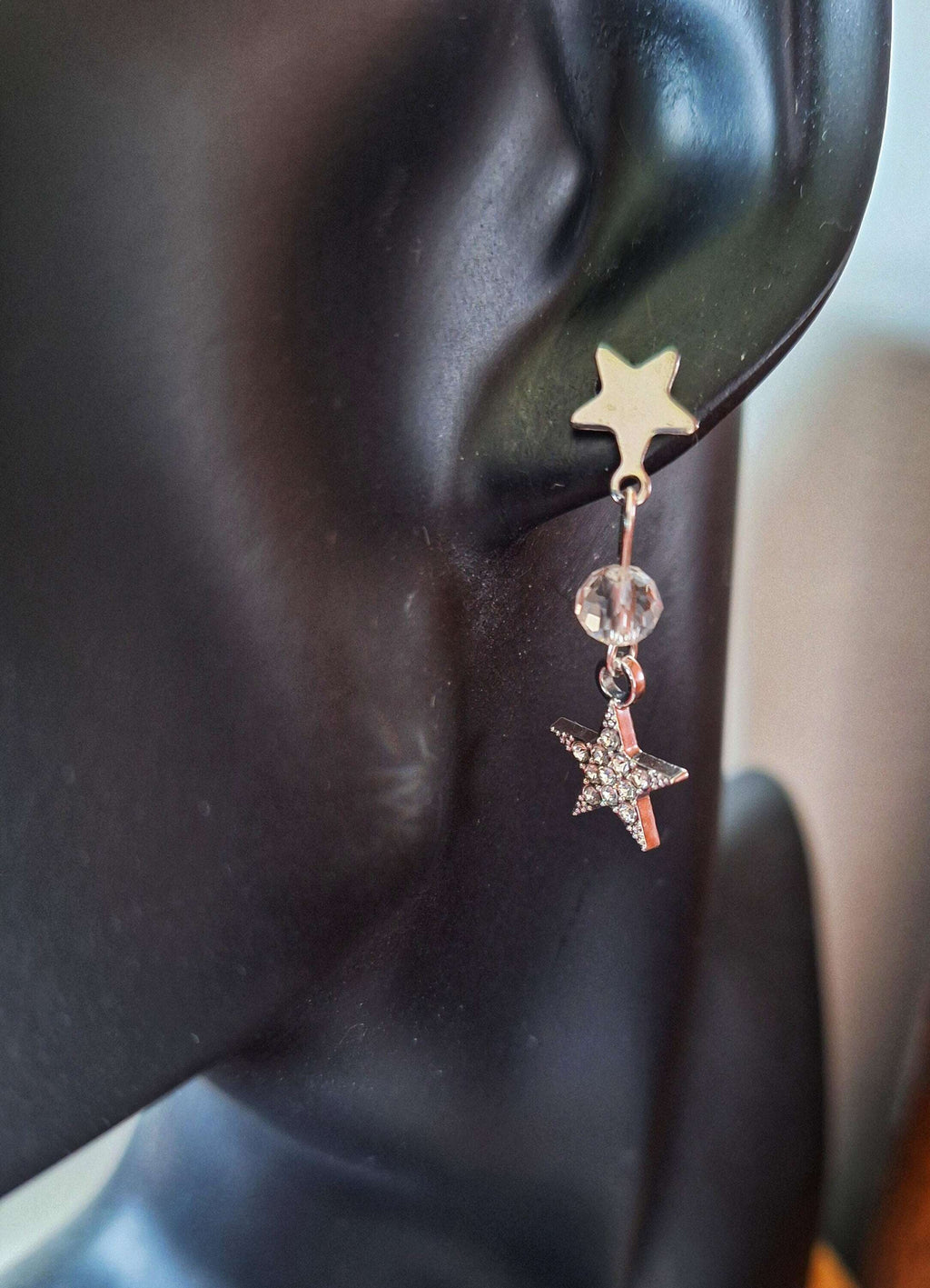 Nova Moon and Star Earrings with crystal beads and silver moon and star charms on star-shaped studs.