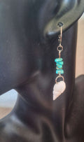 Turquoise and Conch Shell Earrings with turquoise chips and white conch shell on stainless steel huggie.